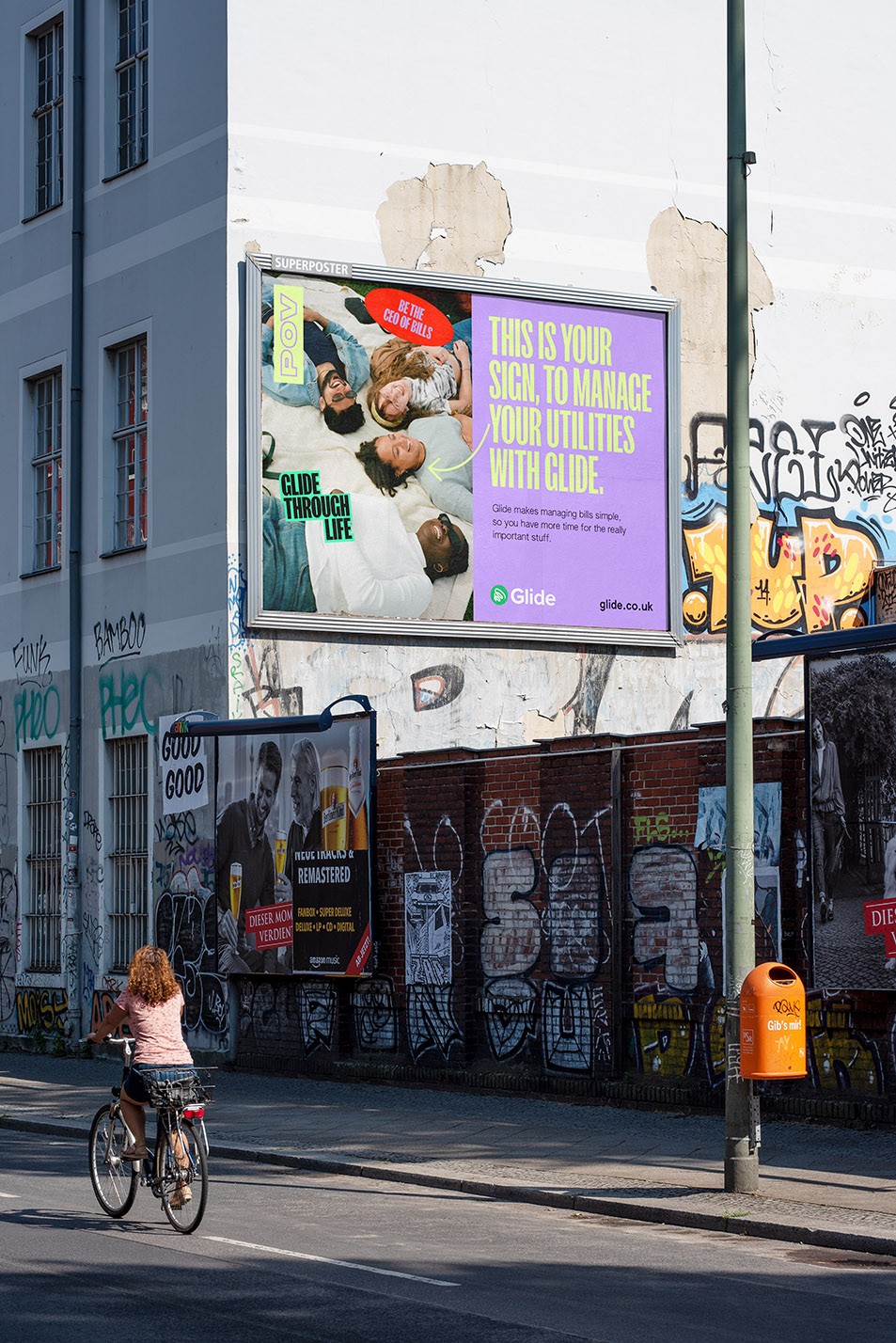 Stylized blue and pink image of a whiskey glass with the wordmark of Vèloce in pink all-caps letters above.